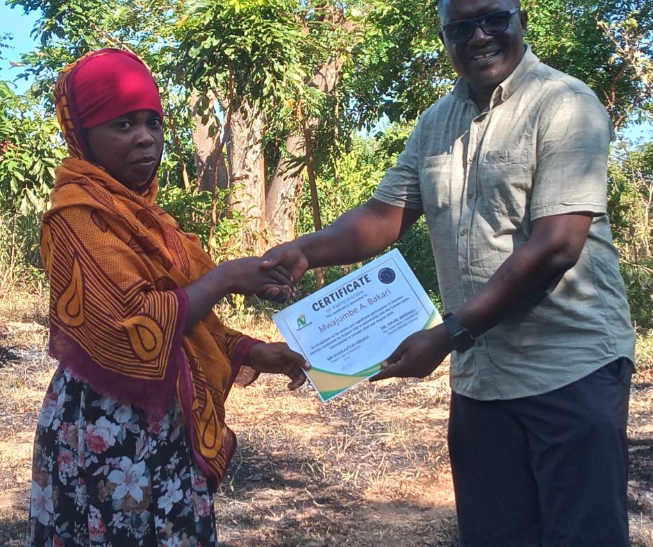 Angaza Vijiji proudly acknowledging a community representative who actively