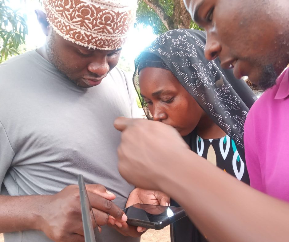 Newton (AV Administrator) trains community representatives to use digital tools (mobile apps) for data collection.